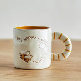 Bloomingville MINI Cloudy Tasse 225 ml Steingut, natur, Schriftzug "Bee Happy"