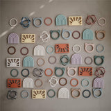 Mushie Beißring Blumen 3er Set, Sunshine/Dried Thyme/Clay, Armband aus Silikon, BPA-frei