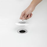 Umbra Flex Badewannenstöpsel, Haarsieb, Abflusssieb für Dusche, Badewanne, Waschbecken, in Weiß