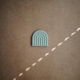 Mushie Beißring Regenbogen, Cambridge Blue, aus Silikon, BPA-frei