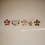 Mushie Sensorik-Spielzeug Blume, Dried Thyme, aus Silikon, BPA-frei