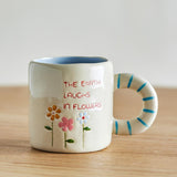 Bloomingville MINI Cloudy Tasse 225 ml Steingut, natur, Schriftzug "The earth laughs in flowers"