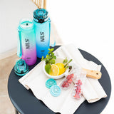 NILS CAMP Trinkflasche Tritan 950 ml türkis-pink mit Fruchteinsatz für Sport Outdoor